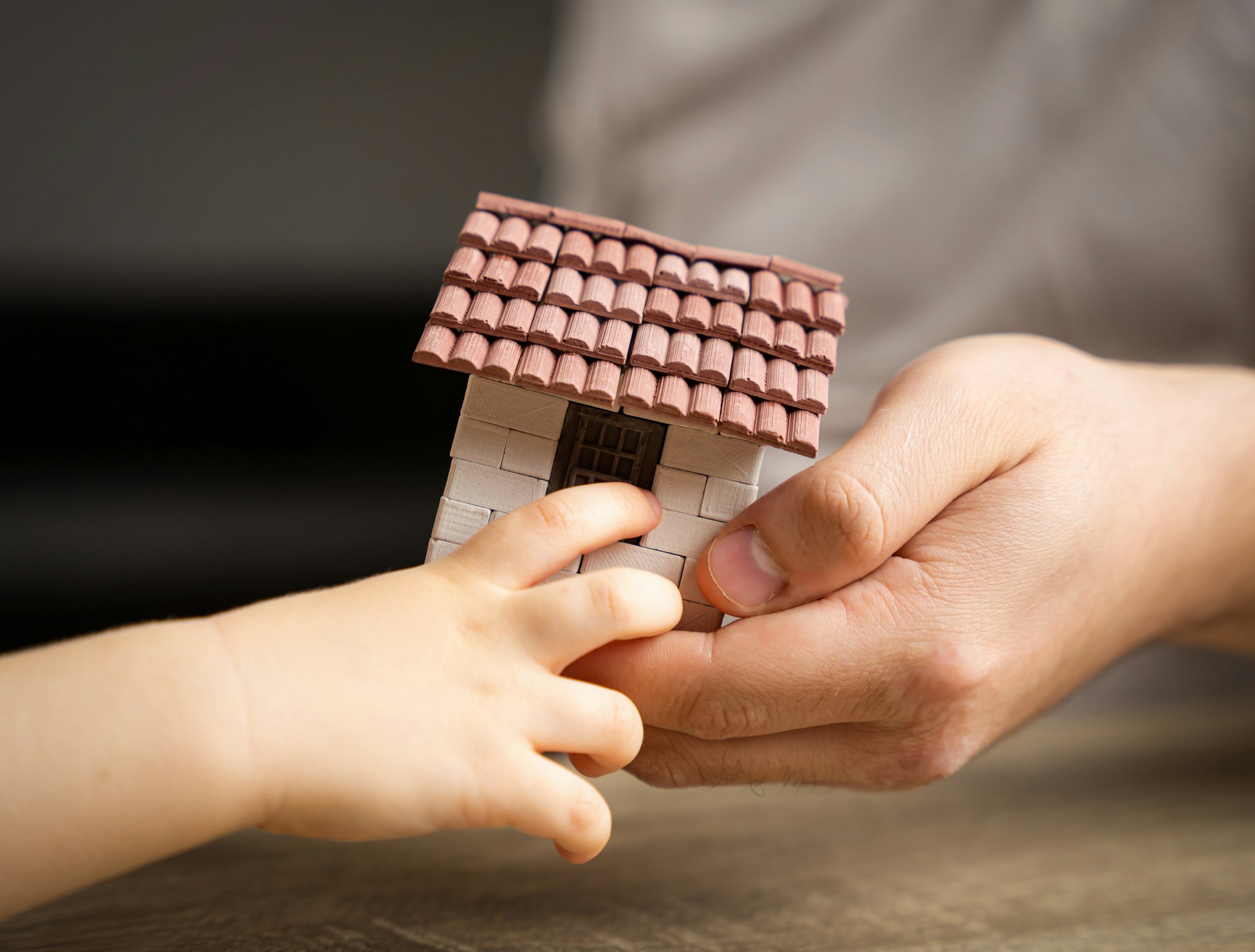 A father gives his son a small house